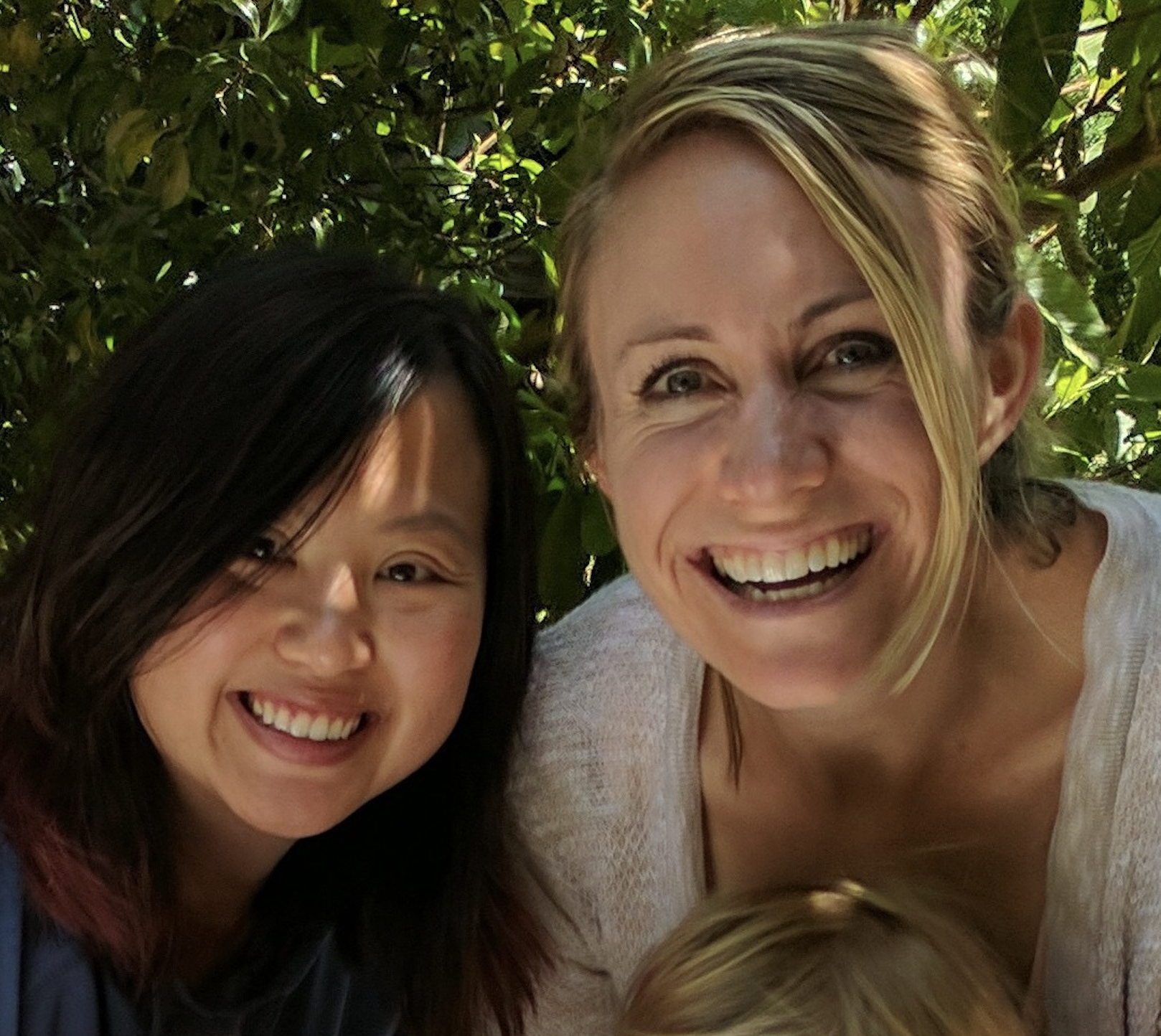 Alice and Meredith smiling together at a birthday celebration