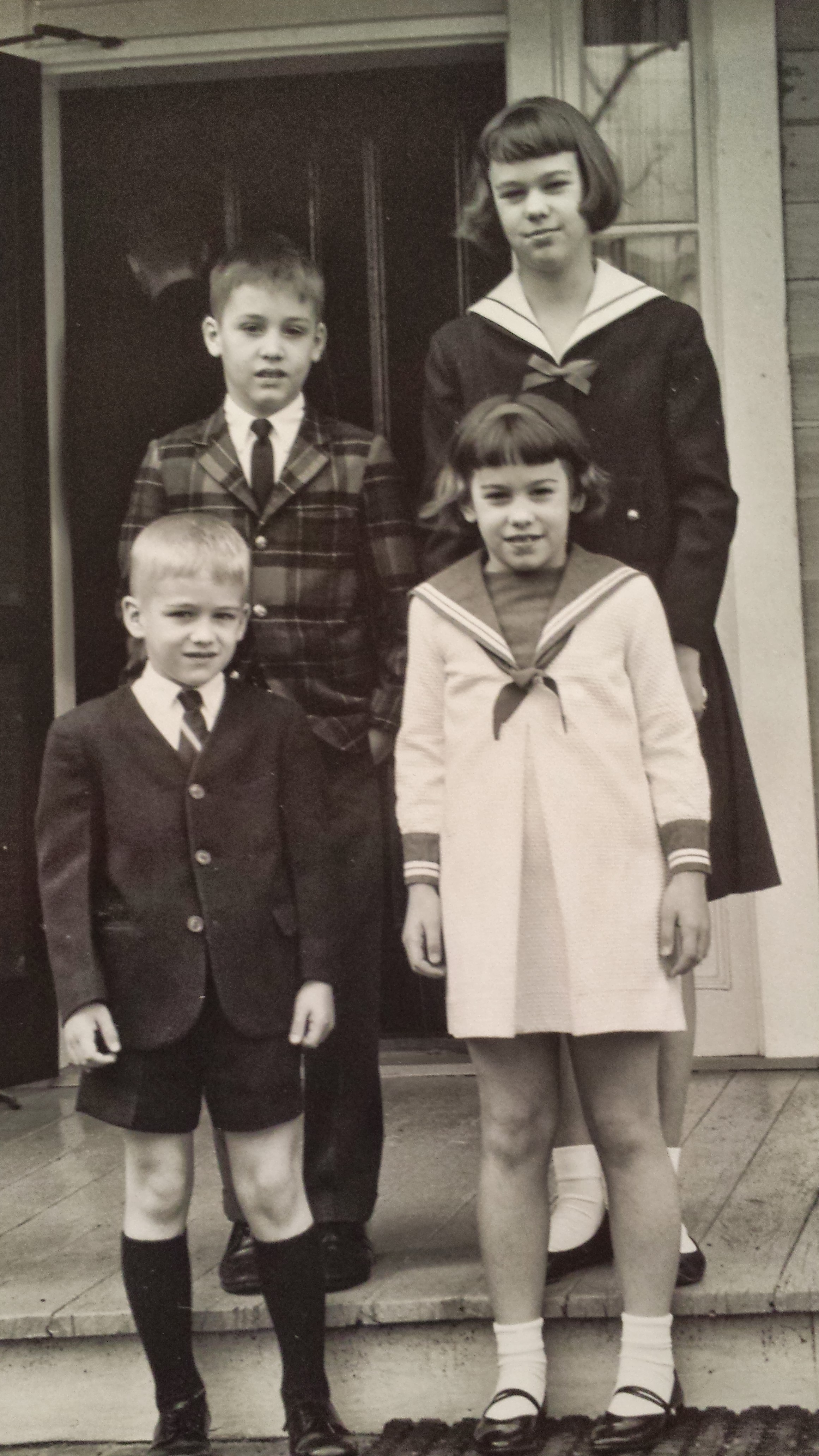 The Haywood siblings as children, sitting together on a porch
