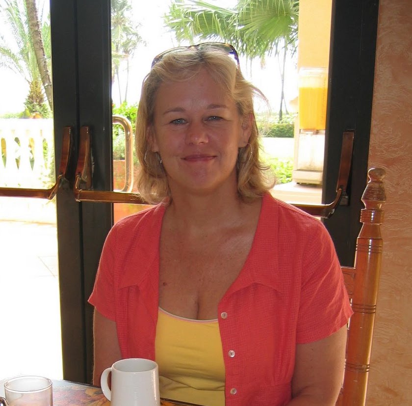 Elizabeth smiling at a café in Puerto Rico, 2005