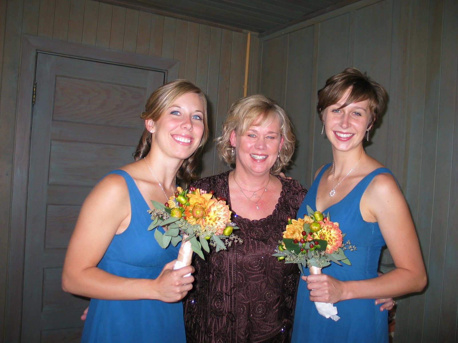 Elizabeth with Mary and Rosemary, all smiling together holding bouquets
